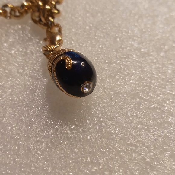 Faberge egg charm bracelet on a gold tone rolo chain. - Picture 6 of 16